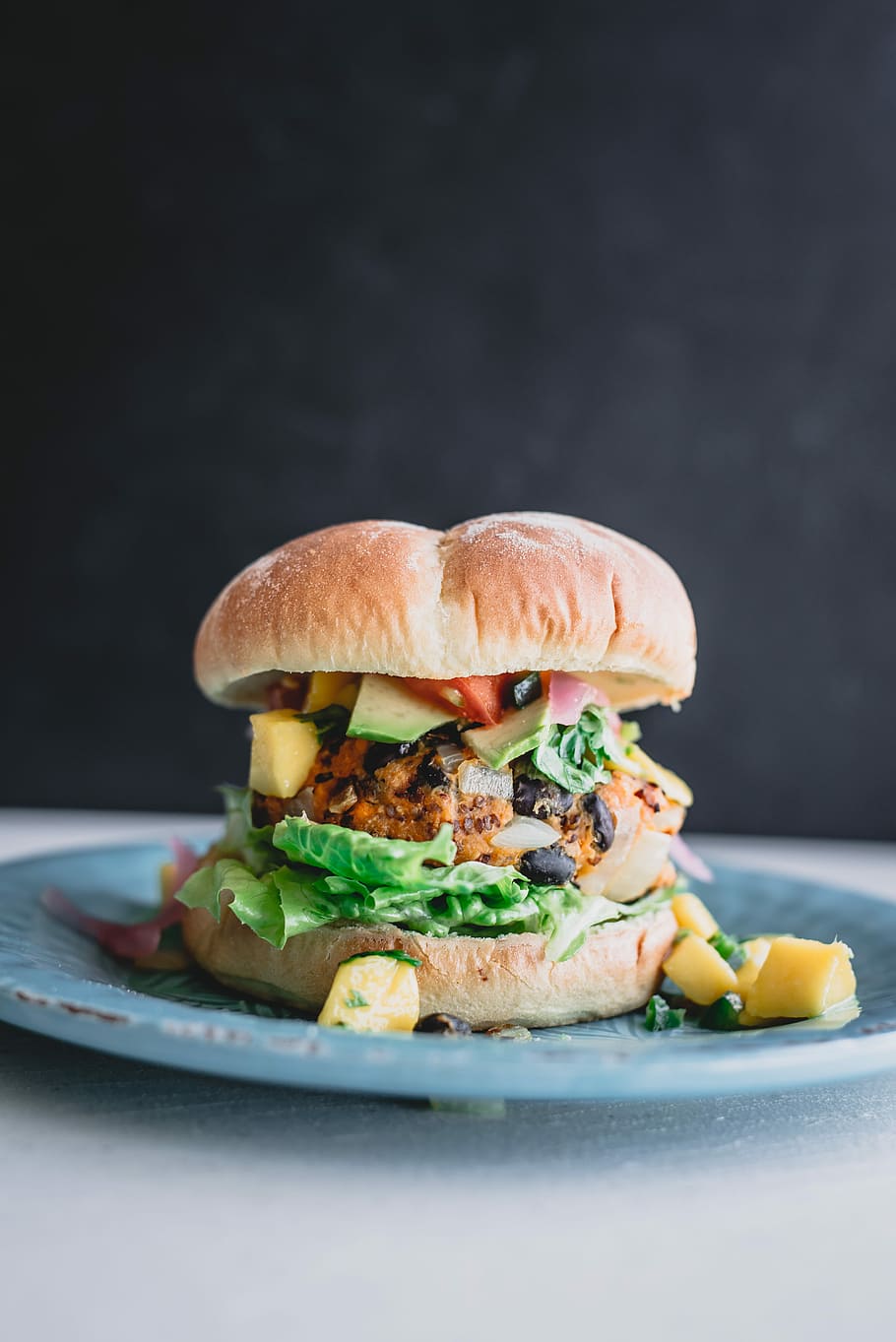 shallow focus photo of hamburger, closeup photography of burger sandwich with vegetables on plate HD wallpaper