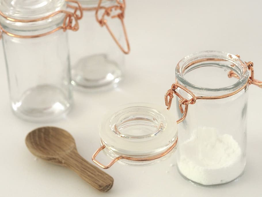 open glass jar near brown wooden spatula, powder in clear glass jar beside clamp lid beside and spoon HD wallpaper