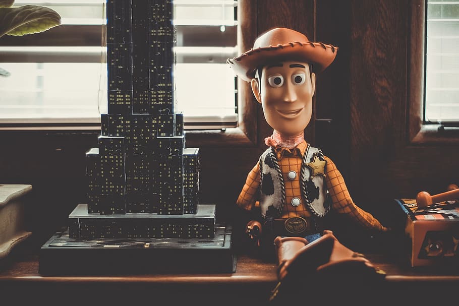 Sheriff woody near building scale model, toy, toy story, childhood