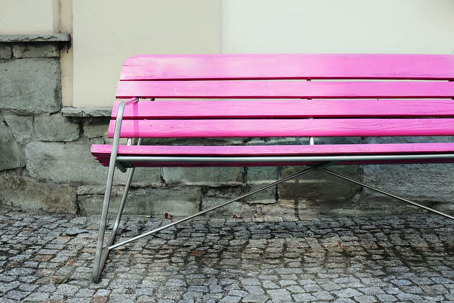 Wide angle shot of a vibrantly coloured pink bench in an urban setting, image captured with a Canon DSLR HD wallpaper