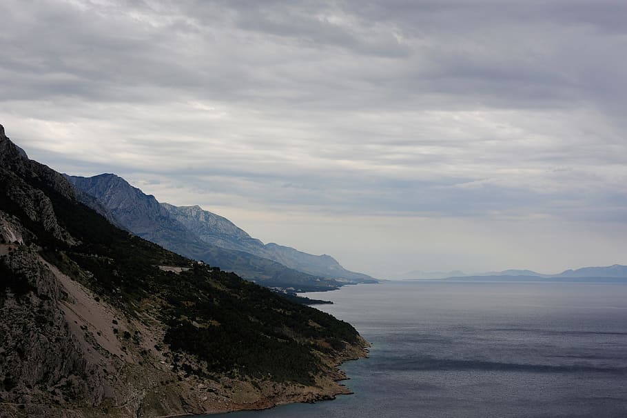 coastline, overcast, cloudy, mountains, hills, ocean, sea, landscape HD wallpaper