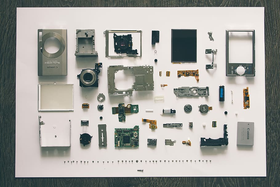 flatlay photography of camera module parts, flat-lay photography of disassembled camera