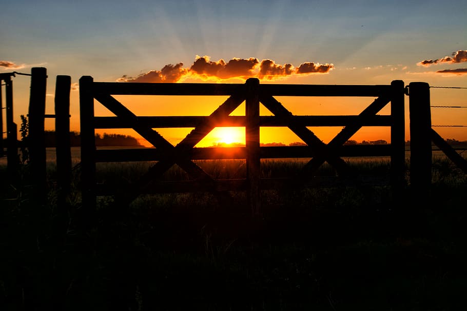 gate, sun, sunset, field, landscape, sky, silhouette, outdoors HD wallpaper