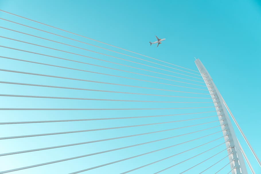 airplane view, airplane above white post, bridge, lines, sky HD wallpaper