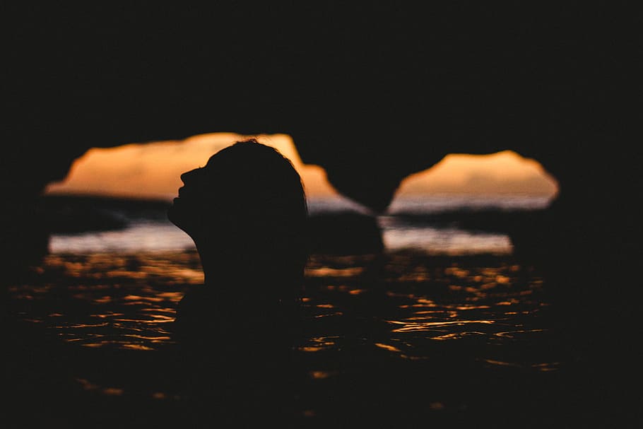 silhouette of woman inside cave, silhouette photography of woman in body of water HD wallpaper