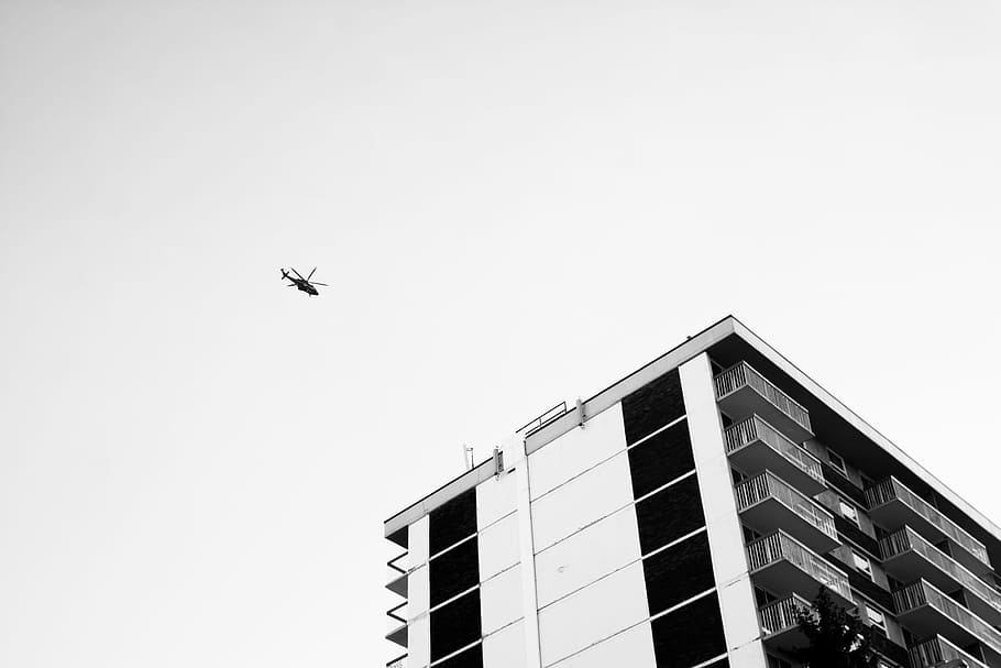low angle view photography of helicopter, helicopter flew in the air near building, HD wallpaper