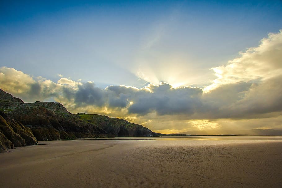 sun light covering clouds, beach, sun rays, ocean, rocks, scenics HD wallpaper