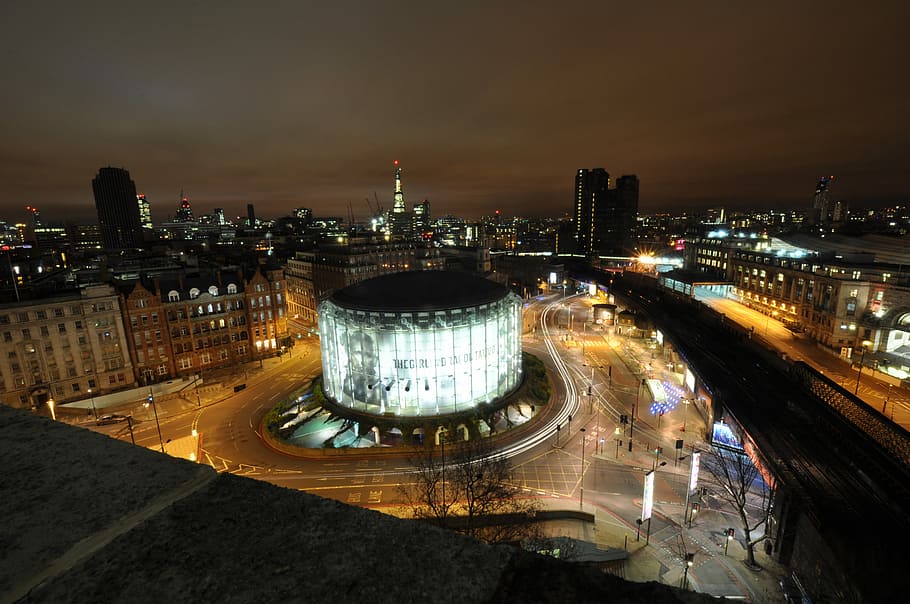 lighted concrete buildings, night, city, skyscraper, roundabout HD wallpaper