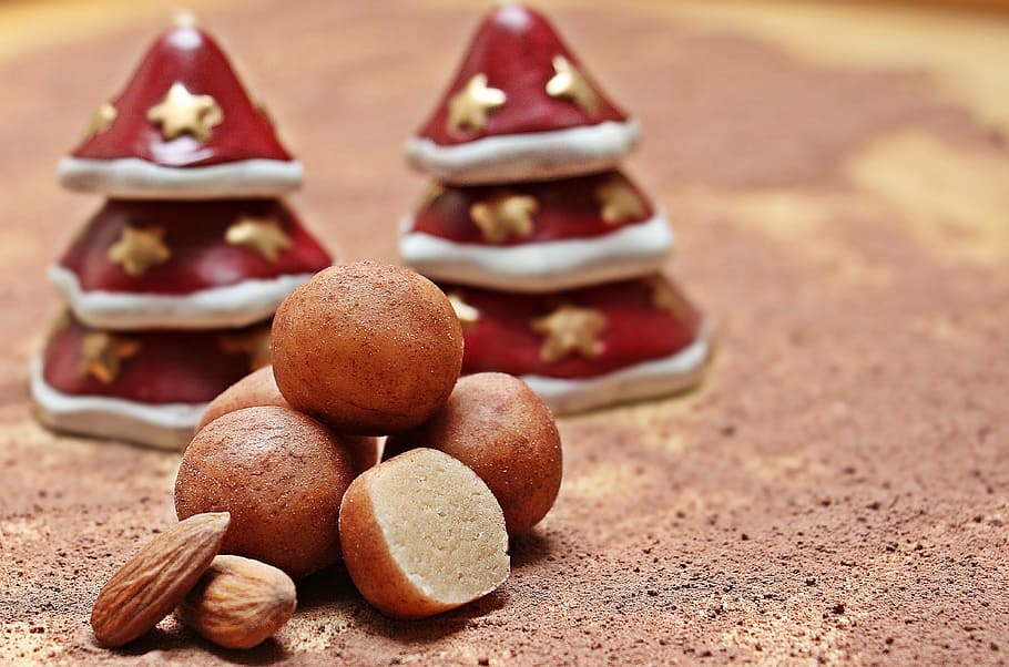 almonds beside pile of pastries, marzipan potatoes, marzipan balls