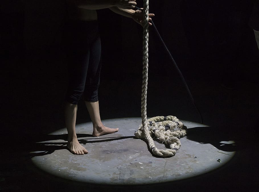 man holding brown rope, chiaroscuro photography of person holding beige riope HD wallpaper
