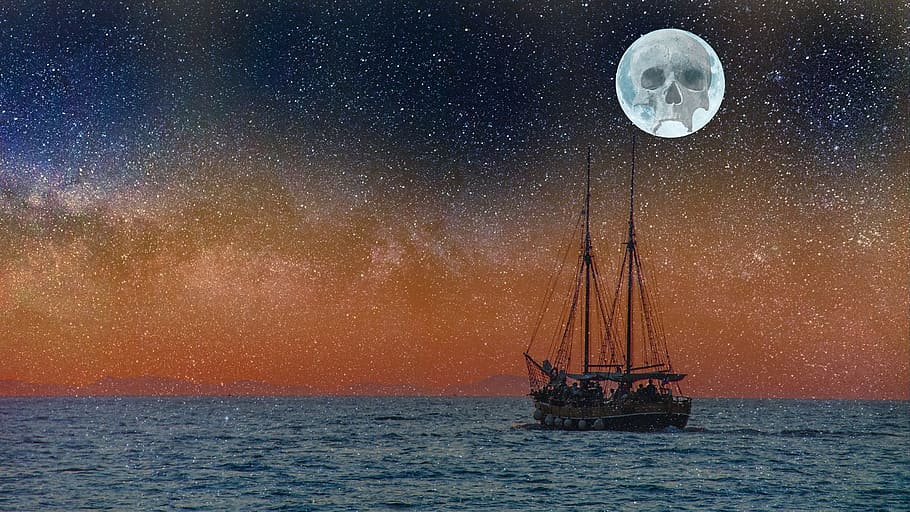 brown wooden sailship under full moon with skull print, star