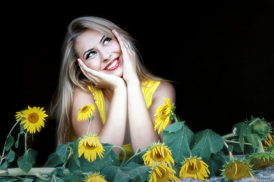 woman wearing yellow sleeveless top, girl, sunflower, smile, portrait