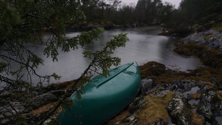 green kayak on rocky river, green kayak near body of water, row boat