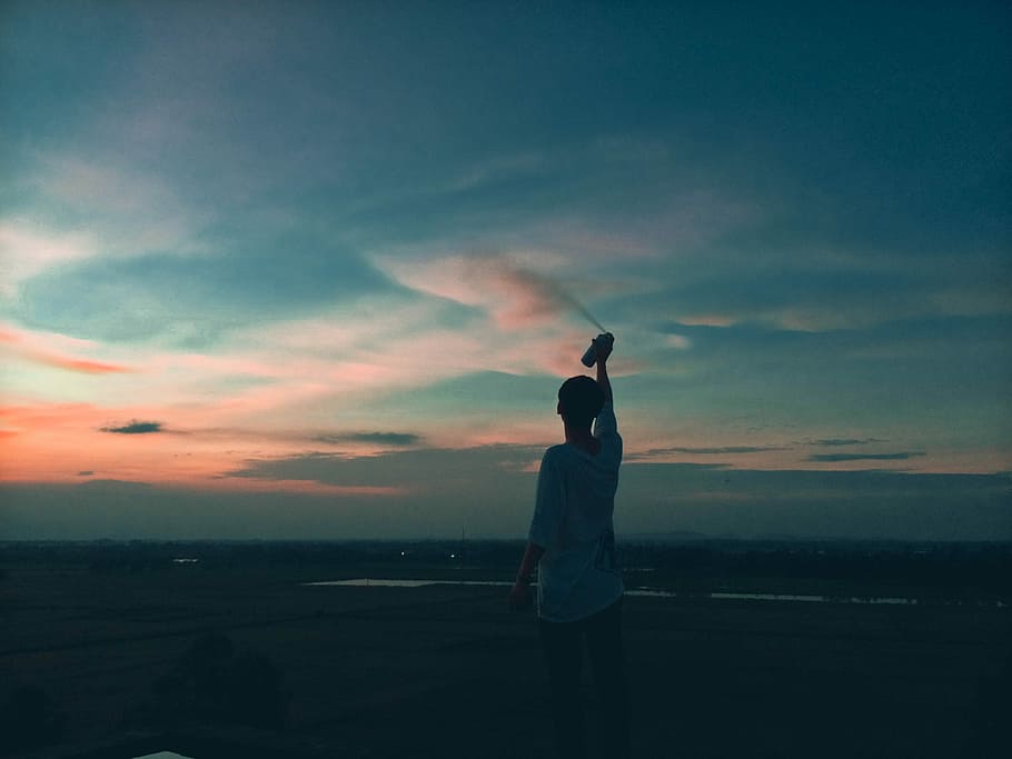 #Sky, person spraying can on the air, sunset, night, boy, man HD wallpaper