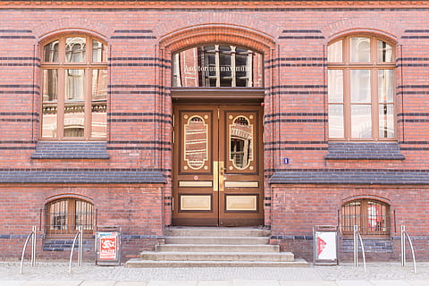 brown wooden door, facade of brown building, concrete, sidewalk HD wallpaper