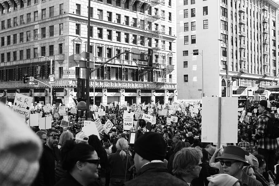 grayscale photography of people protesting in front of concrete building, grayscaled photo of crowd