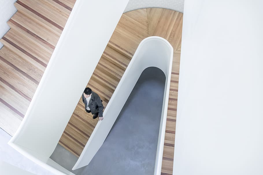 man standing on brown stairs, architecture, building, carpentry HD wallpaper