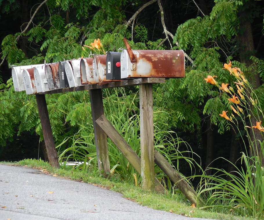 assorted-color mail post beside road at daytime, Rural, Mailbox