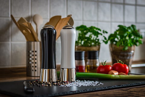 two white and black condiment shakers on black board, pepper HD wallpaper