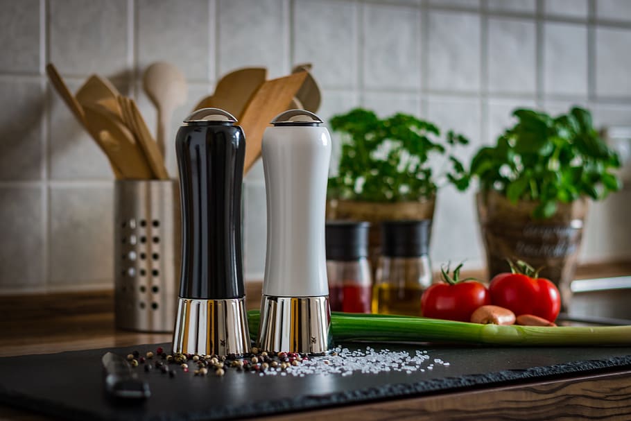 two white and black condiment shakers on black board, pepper HD wallpaper