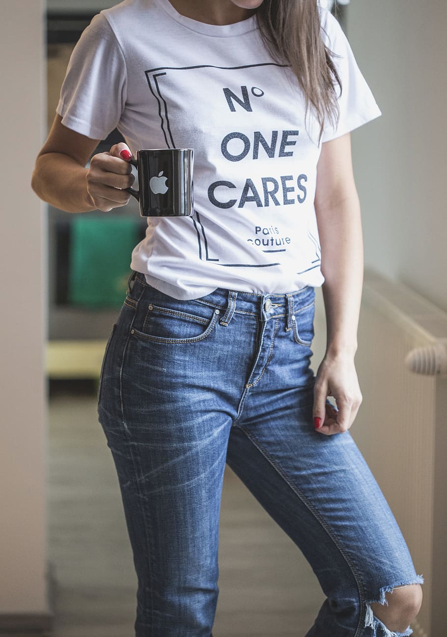 Hd Wallpaper Woman Wearing White Shirt And Blue Jeans Holding Black Ceramic Coffee Mug With Apple Logo Wallpaper Flare