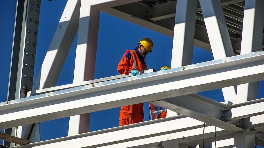 man wearing orange safety suit during daytime, worker, helmet