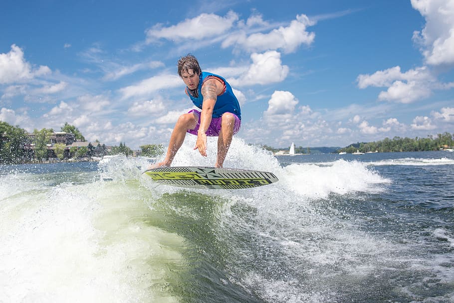 man surfing during daytime, man riding on surfboard with sea wave HD wallpaper