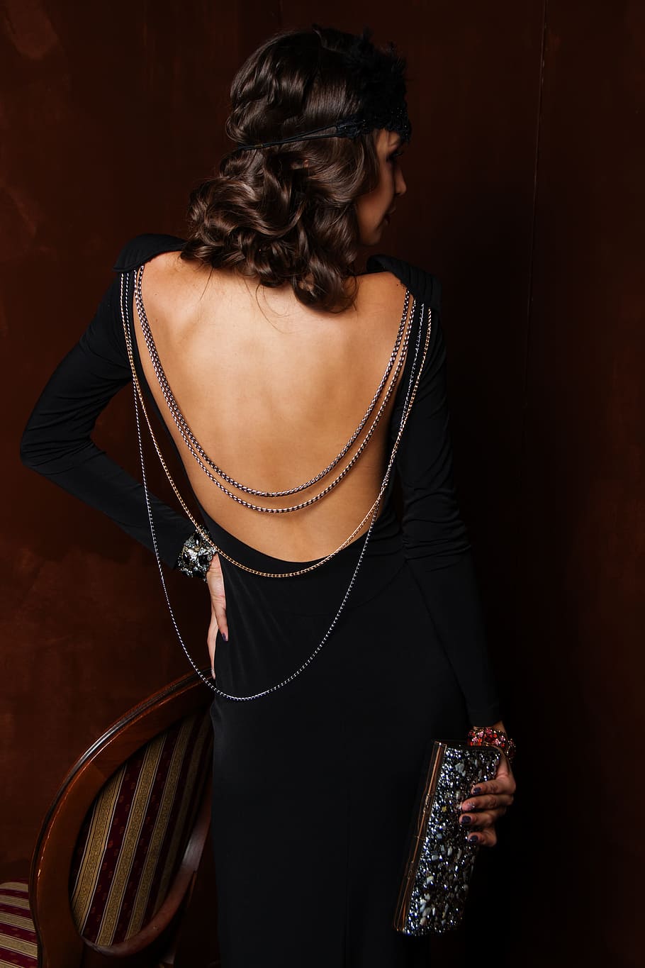 woman wearing black long-sleeved dress holding glitter wallet, HD wallpaper