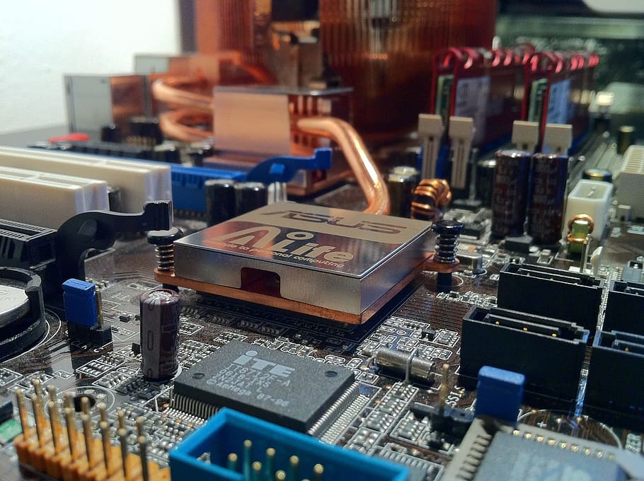 person taking photo of black Asus computer motherboard, electric HD wallpaper