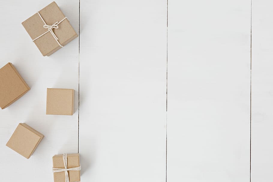 brown gift box on white surface, five brown gift boxes on the white wood HD wallpaper