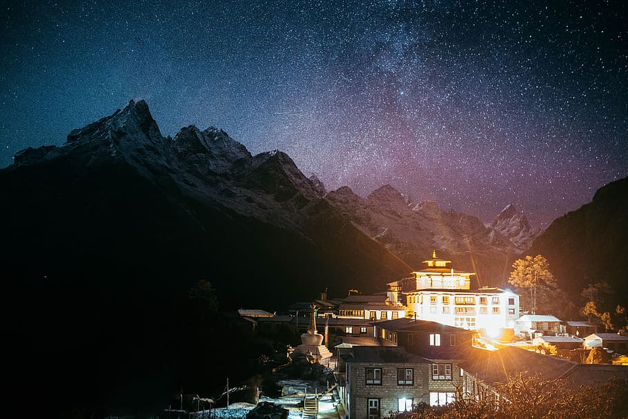 photography of house in front of mountain, house near mountain during night HD wallpaper