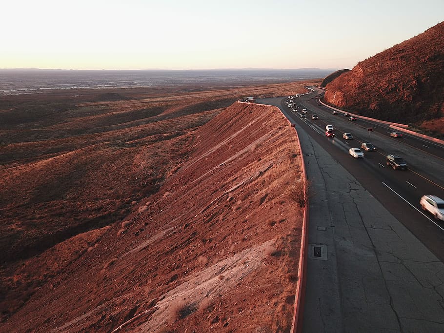 aerial photography of road and mountain, gray asphalt road on mountain cliff HD wallpaper