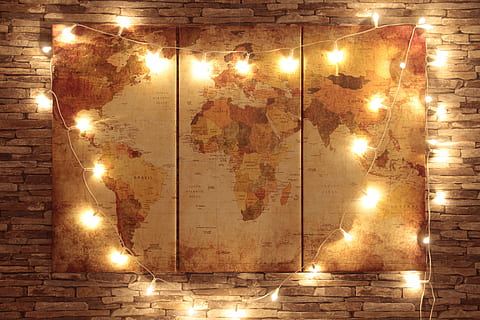 world man 3-panel decor with string lights mounted on brown bricked wall HD wallpaper
