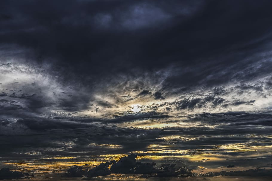 HD wallpaper gray clouds during golden hour dramatic sky