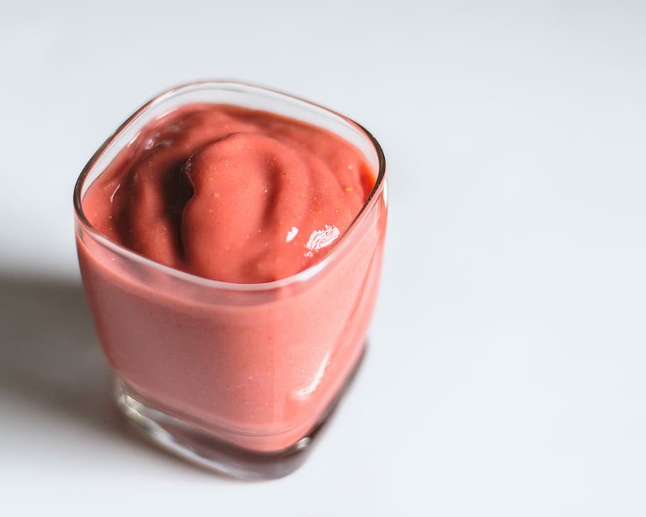 clear glass cup with pink cream, closeup photography ofg red cream in drinking glass HD wallpaper