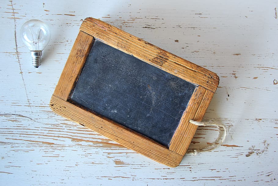 rectangular brown wooden framed board and incandescent bulb HD wallpaper