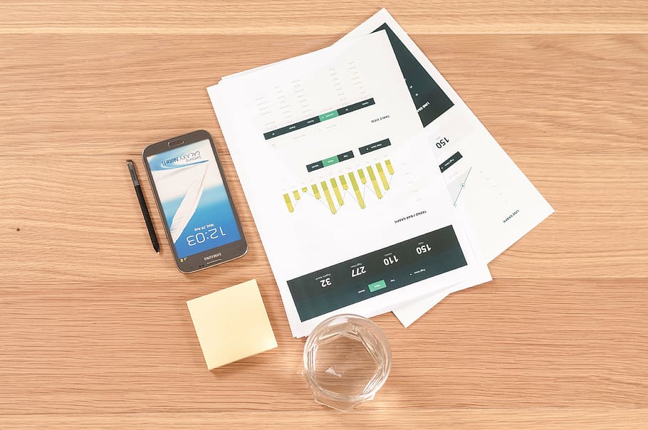 black Android smartphone on brown table, books, business, reports HD wallpaper