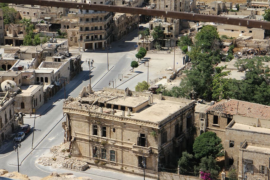 aerial view of gray concrete building, destruction, war zone