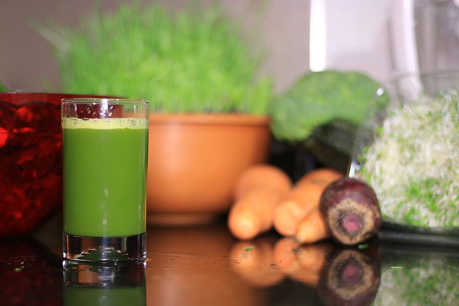 selective focus photography of clear drinking glass filled with green liquid HD wallpaper