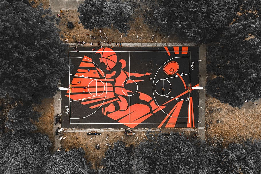 black and red outdoor basketball court, aerial view of black and red basketball court