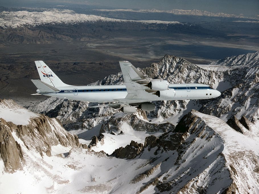 white airliner over mountains, airplane, flying, dc 8, nasa laboratory