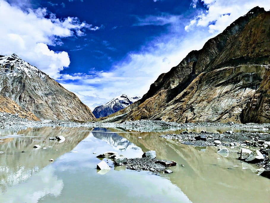 body of water between mountains under blue and white sky, lake HD wallpaper