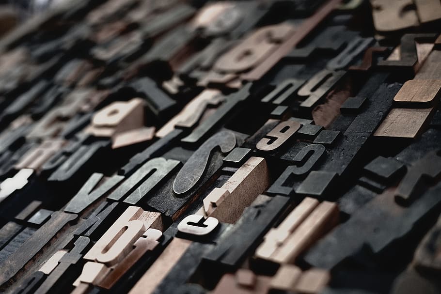 shallow focus photography of embossed letters and special characters HD wallpaper