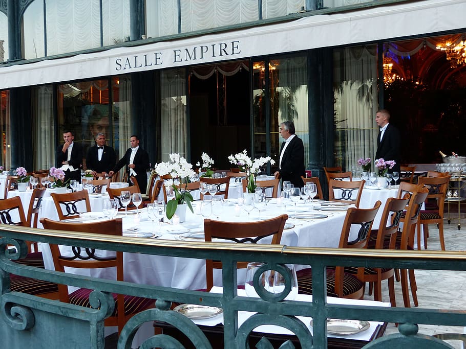 five men standing near tables, local, hotel, inn, extravagant