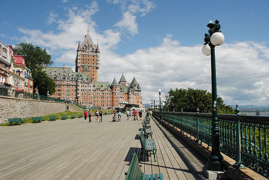 group of people walking near brown castle, quebec, chateau, frontenac