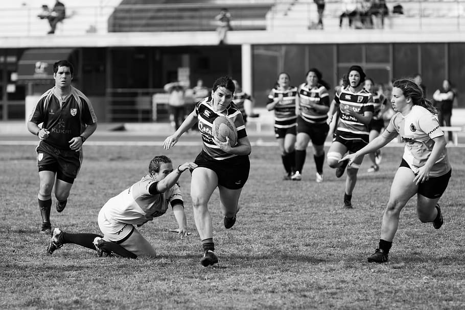 grayscale photo of women playing rugby football, group of woman playing soccer in grayscale photo