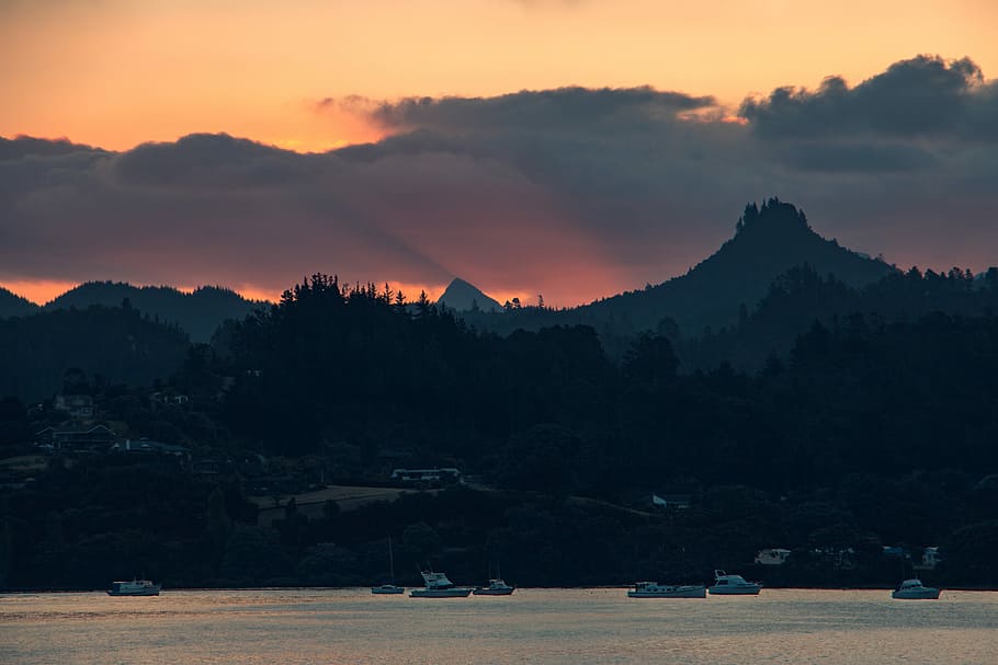 mountains under golden hour, boat on body of water near mountain at golden hour HD wallpaper