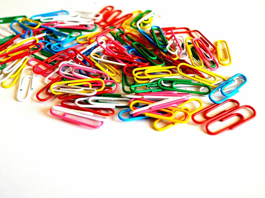 assorted-color paper clip lot on table, clips, background, business