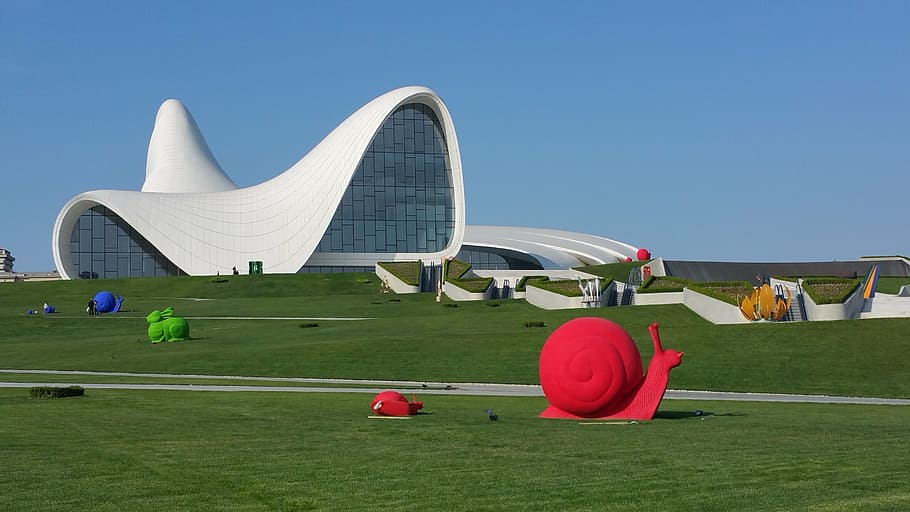 white concrete museum at daytime, baku, azerbaijan, haliyev center
