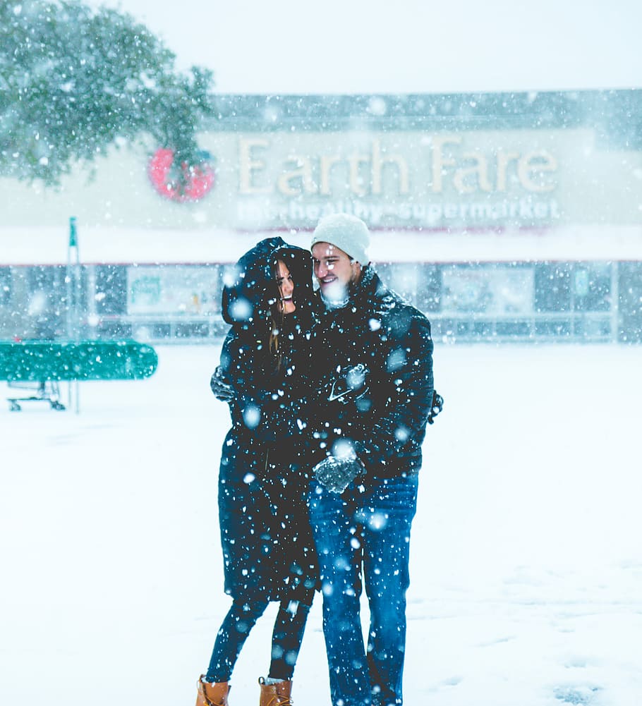 man and woman standing on snowing surface, woman and man in snow HD wallpaper